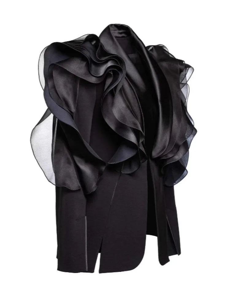 Black ruffled top.